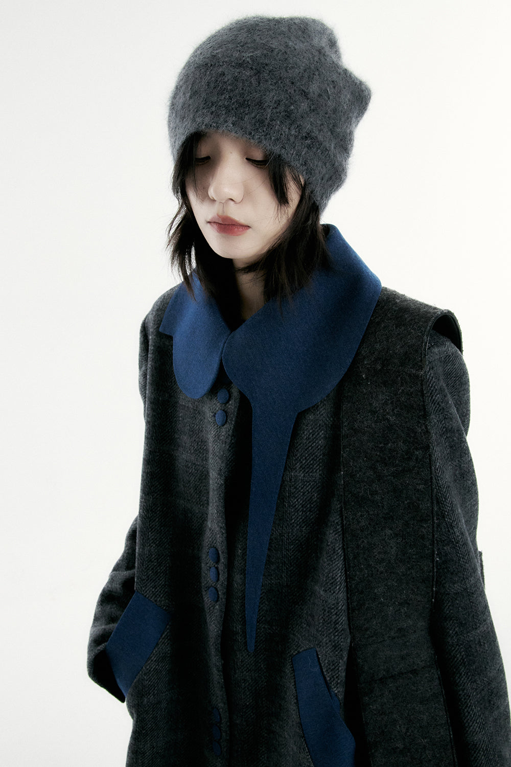 Irregular shaped lapel wool coat